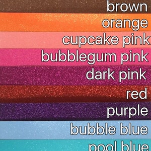 May include: A swatch card showing 16 different glitter colors, including vanilla, silver, champagne, gold, copper, brown, orange, cupcake pink, bubblegum pink, dark pink, red, purple, bubble blue, pool blue, blue jean, royal blue, charcoal grey, and black.