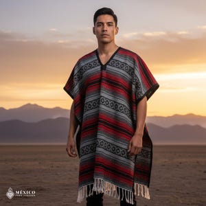 May include: A traditional poncho with a V-neck, featuring horizontal stripes in red, gray, and black. The poncho has a fringed hem and is worn by a person. The background shows a desert landscape with mountains and a sunset.