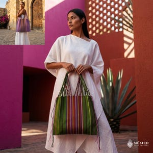 May include: A white ceramic mug with a black handle and the text "But First, Coffee" in a bold, black font. The mug is set against a blurred background, suggesting a cozy setting.