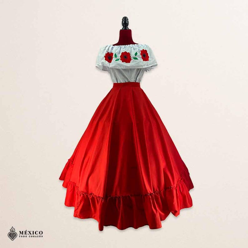 May include: A two-piece dress featuring a white off-the-shoulder top with red floral embroidery and green leaves, paired with a long, solid red skirt with a ruffled hem. The text "M&Eacute;XICO TODO CORAZ&Oacute;N" appears in the bottom left corner.