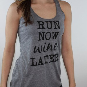 May include: Gray tank top with black text that reads "Run Now Wine Later".