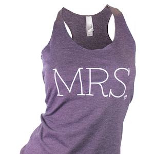 May include: Purple tank top with the word "MRS" in white lettering.
