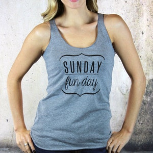 May include: Gray tank top with the text "SUNDAY fun day" in a black decorative frame.