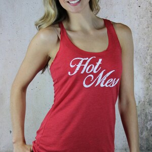 May include: A red tank top with a white graphic that says "Hot Mess".