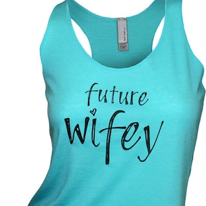 May include: A turquoise tank top with the text "future wifey" in black lettering and a small heart.