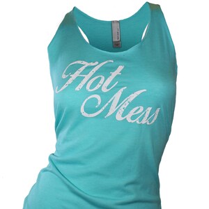 May include: A turquoise tank top with the words "Hot Mess" printed in white on the front.