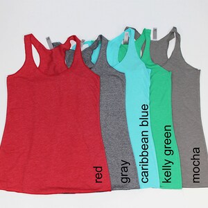 May include: Five tank tops in different colors: red, gray, caribbean blue, kelly green, and mocha.