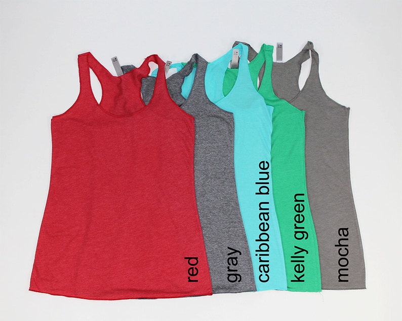 May include: Five tank tops in different colors: red, gray, caribbean blue, kelly green, and mocha.