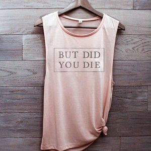 May include: A peach-colored sleeveless tank top with the text "BUT DID YOU DIE" printed in a black rectangle on the front.