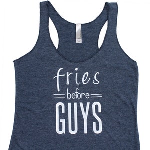 May include: A dark blue tank top with the text "fries before guys" printed in white.
