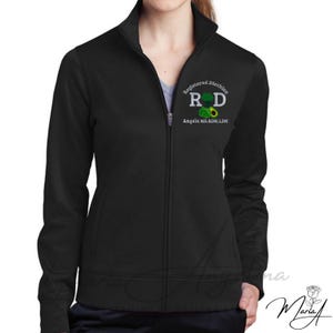 May include: A black long-sleeve zip-up jacket featuring an embroidered logo on the left chest that reads Registered Dietitian RD with a broccoli and avocado graphic, and the text Angela MS.RDN.LDN printed below the graphic.
