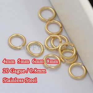 May include: A collection of gold-colored jump rings in various sizes, including 4mm, 5mm, 6mm, and 8mm. The rings are made of stainless steel and are 20 gauge, or 0.8mm thick.