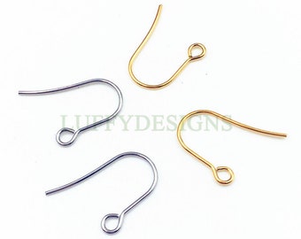 May include: Four earring hooks, two gold and two silver, are shown on a white background. The hooks are all the same size and shape, with a small loop at the top and a curved wire that ends in a point.