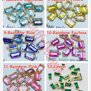 May include: Assortment of 12 rainbow colored glass charms with gold metal loops. The charms are rectangular and have a faceted design. The colors include light blue, yellow, blue, fuchsia, pink, and green.