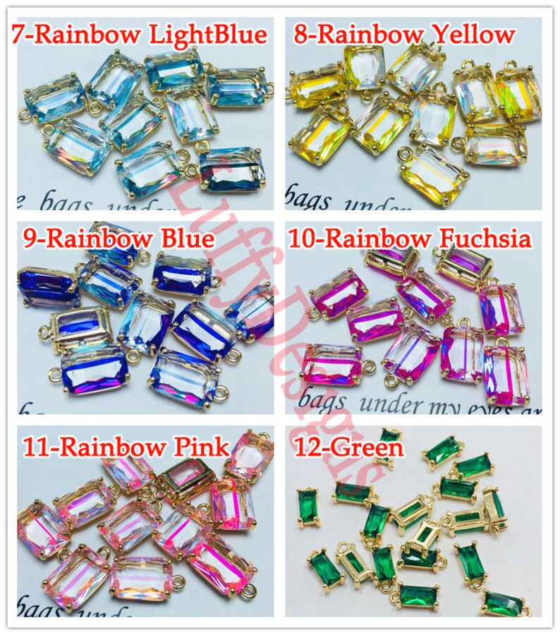 May include: Assortment of 12 rainbow colored glass charms with gold metal loops. The charms are rectangular and have a faceted design. The colors include light blue, yellow, blue, fuchsia, pink, and green.