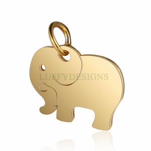 May include: Gold-colored elephant charm with a loop for attaching to a necklace or bracelet. The charm is made of metal and has a smooth, shiny finish.