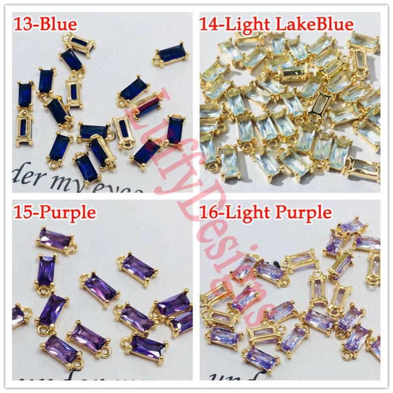 May include: Assortment of gold-toned metal connector charms with different colored glass stones. The stones are blue, light blue, purple, and light purple. The charms are rectangular with a loop at the top.