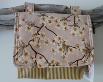 waterproof handlebar bag with stripes and flowers cherry blossoms in old pink mustard yellow made from Au Maison oilcloth