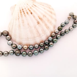 Exotic Tahitian ROUND BLACK Pearl Necklace. One of a kind lustrous and affordable. The strand has included 3 carved pearls. #59