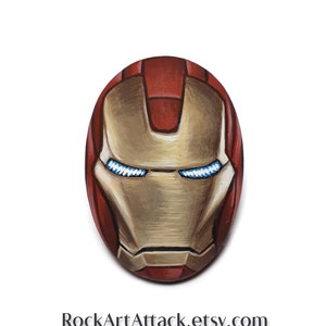 Superhero Helmet Pebble painting Art with acrylics. satin varnish finish,  hand painted pebbles, Superhero painting.