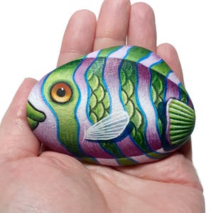 Green fish with red violate stripes hand painted stone. Rock painting art with acrylics and finished with satin varnish. fish table decor.