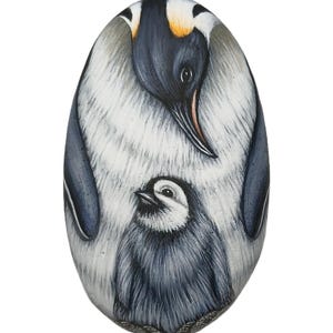 Penguin with her baby hand painted on sea stone with Acrylics and finished with satin varnish. Miniature animal art by rockartattack.