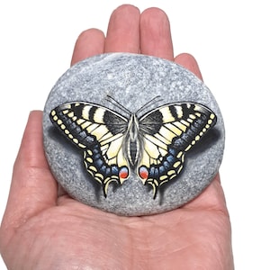 Handmade Beautiful swallowtail butterfly painted on flat natural sea stone. Hand painted with Aclylics and finished with Satin varnish.