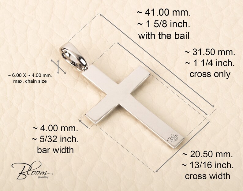 K&ouml;nnte beinhalten: Silberner Kreuzanh&auml;nger mit einer &Ouml;se, der mit &Ouml;se 4,1 cm und ohne &Ouml;se 3,1 cm misst. Das Kreuz ist 2,1 cm breit und die Stange 0,4 cm breit.