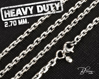 May include: A silver chain necklace with a lobster clasp. The chain is 2.70 mm wide and is labeled "Heavy Duty".