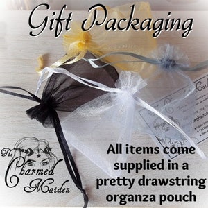 May include: Several organza drawstring pouches in yellow, black, white, and blue are displayed. The text "Gift Packaging" is at the top, and the text "All items come supplied in a pretty drawstring organza pouch" is at the bottom.