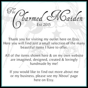 May include: A white graphic with the text "The Charmed Maiden Est 2015" in elegant script. The text thanks visitors and highlights handmade items available on Etsy and the seller's website.