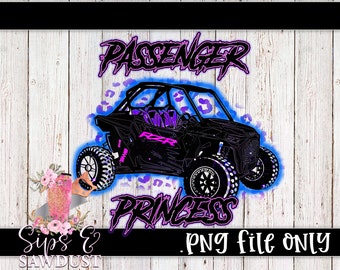 May include: A black and blue graphic design of a side-by-side off-road vehicle with pink and purple text that reads "Passenger Princess".