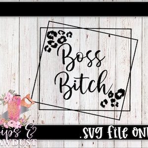 May include: Black and white graphic design featuring the text "Boss Bitch" within a black square frame with leopard print accents. The design is set against a white wood backdrop.