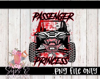 May include: A red and black off-road vehicle with a pink and black leopard print design. The vehicle has the words "Passenger Princess" written in red on the front.
