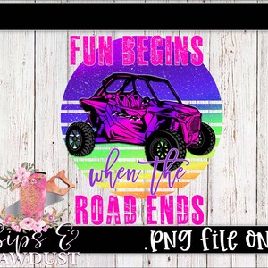 May include: A vibrant graphic featuring a purple off-road vehicle with the text "FUN BEGINS when the ROAD ENDS" in a colorful design. The image is set against a backdrop of a sunset and a wooden plank background.
