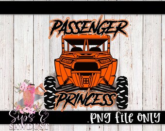 May include: An orange and black graphic of an off-road vehicle with the words "PASSENGER PRINCESS" in a stylized font. The image is set against a white wood-grain background. The text "PNG file ONLY" is also included.