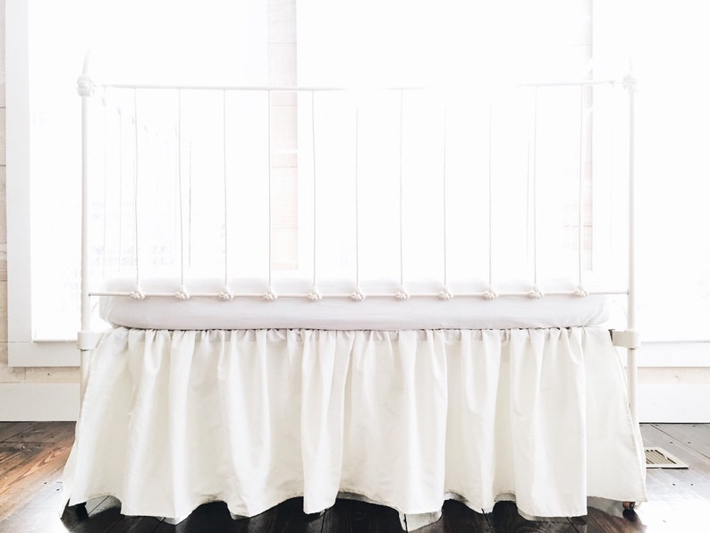 beige crib skirt