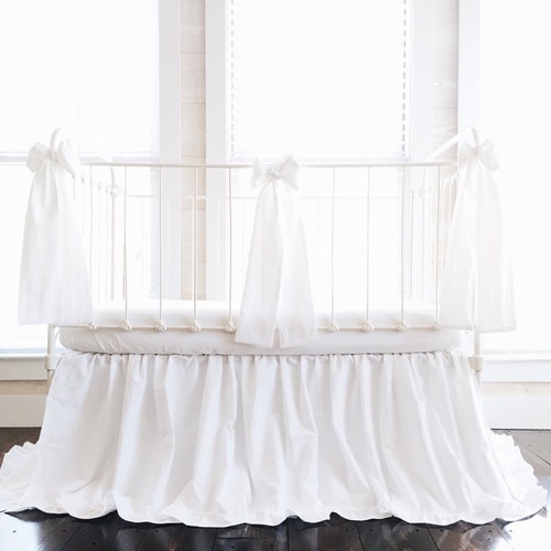 white ruffle crib bedding