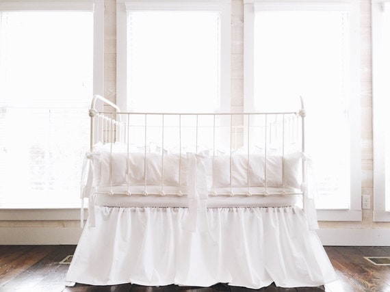 white ruffle crib bumper