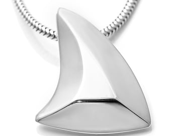 May include: A silver necklace with a shark fin pendant. The pendant is smooth and shiny, with a sharp point at the top.