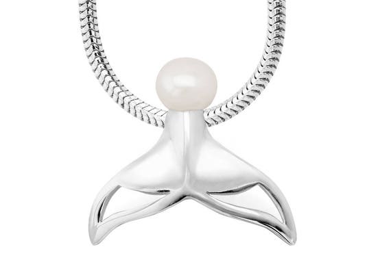 whale tail pendant meaning