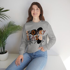 Spooky Season Patterned Letters Unisex Heavy Blend Crewneck Sweatshirt