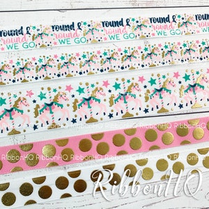 May include: Four different ribbon designs featuring a carousel horse and stars with the text "round & round we go" repeated on the first ribbon. The second ribbon features a pink and white polka dot pattern with gold polka dots. The third ribbon features a white and gold polka dot pattern. The fourth ribbon features a pink and gold polka dot pattern.