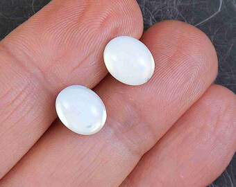 Opalescent white 10x8 mm vintage glass oval stud earrings with golden sheen on hypoallergenic stainless steel posts