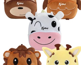 May include: Five plush animal-themed backpacks. The backpacks are shaped like a monkey, owl, cow, lion, and giraffe. Each backpack has a zipper closure and the word "Name" printed on it. The monkey backpack is brown, the owl is orange, the cow is white and pink, the lion is brown, and the giraffe is yellow.