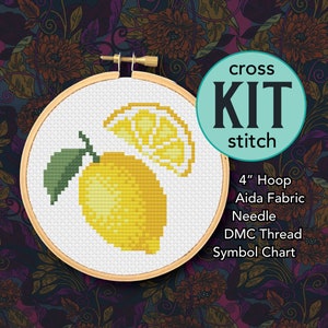May include: Cross stitch kit featuring a lemon with a slice, in a 4 inch hoop. The kit includes Aida fabric, a needle, DMC thread, and a symbol chart.