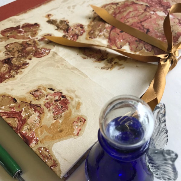 Handmade Portfolio with writing paper covered in marbled paper and linen