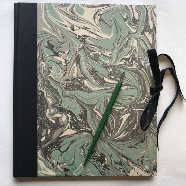 Handmade Portfolio with writing paper covered in marbled paper and linen