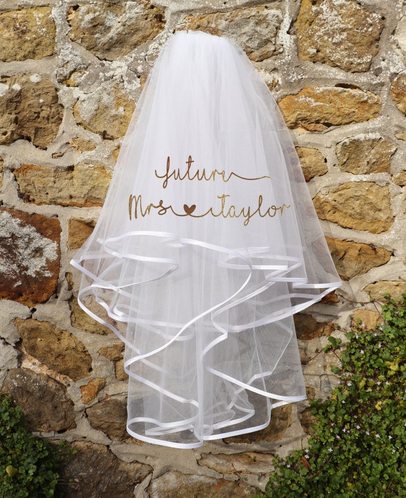 Hen veil with wording 'Future Mrs Taylor' printed on