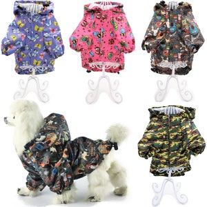 May include: Five dog raincoats in different patterns. The raincoats are purple with butterflies, pink with bees and butterflies, gray with cartoon animals, camouflage, and black with cartoon animals.